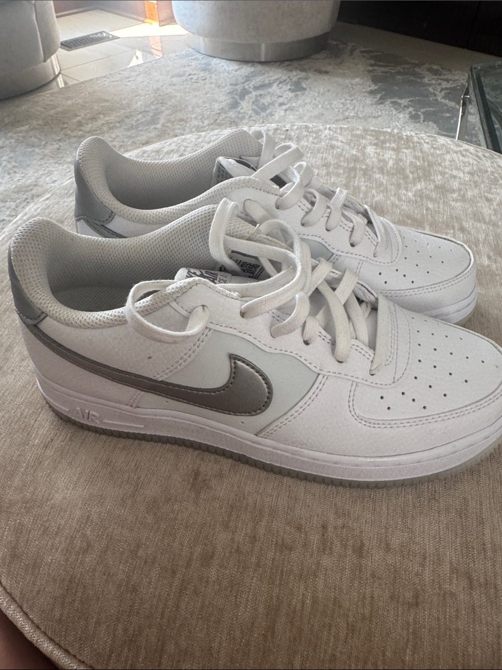 Nike White Air Force 1 Low-Top Sneakers with Metallic Silver Swoosh